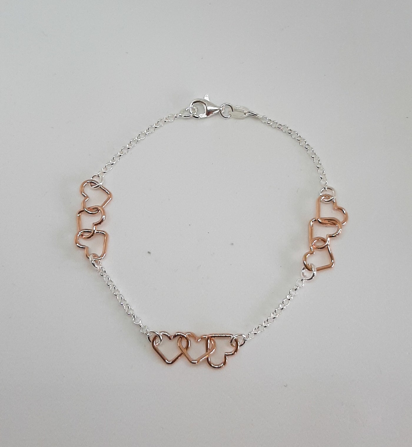 Silver & Rose Gold Linked Hearts Bracelet