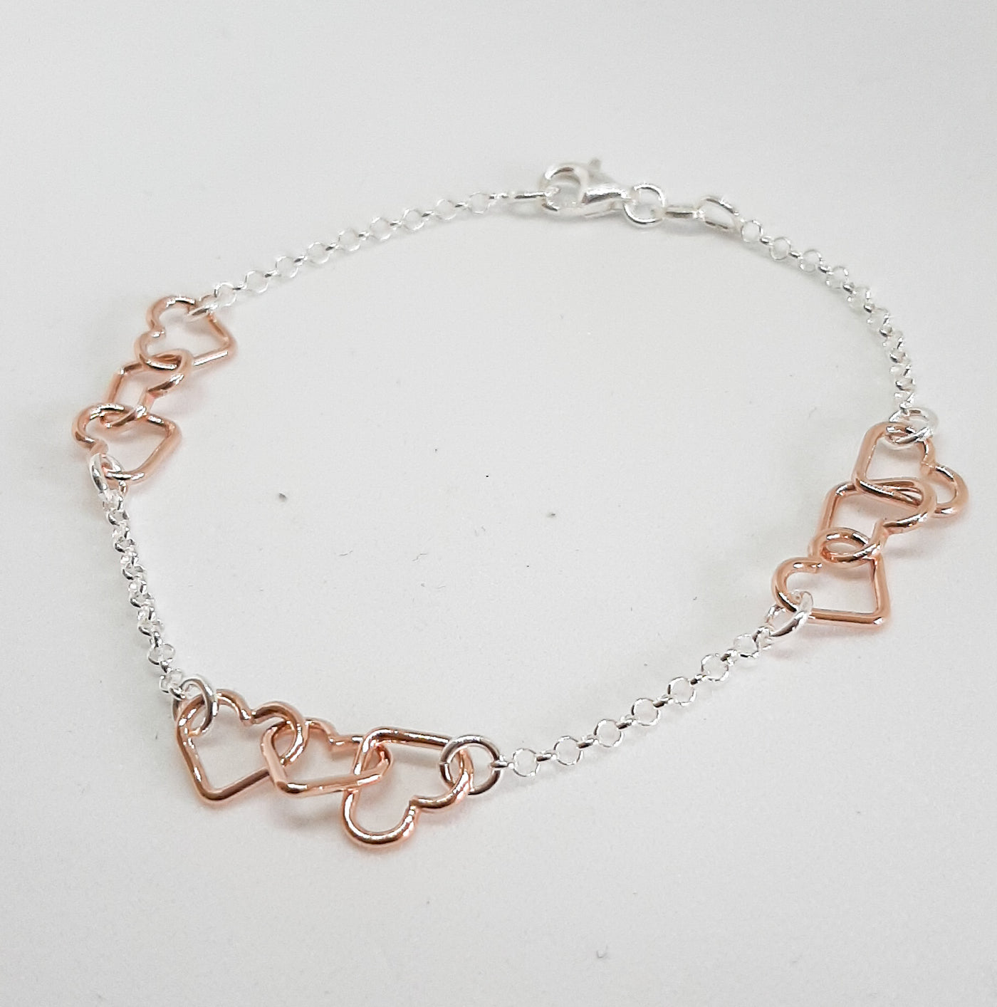 Silver & Rose Gold Linked Hearts Bracelet