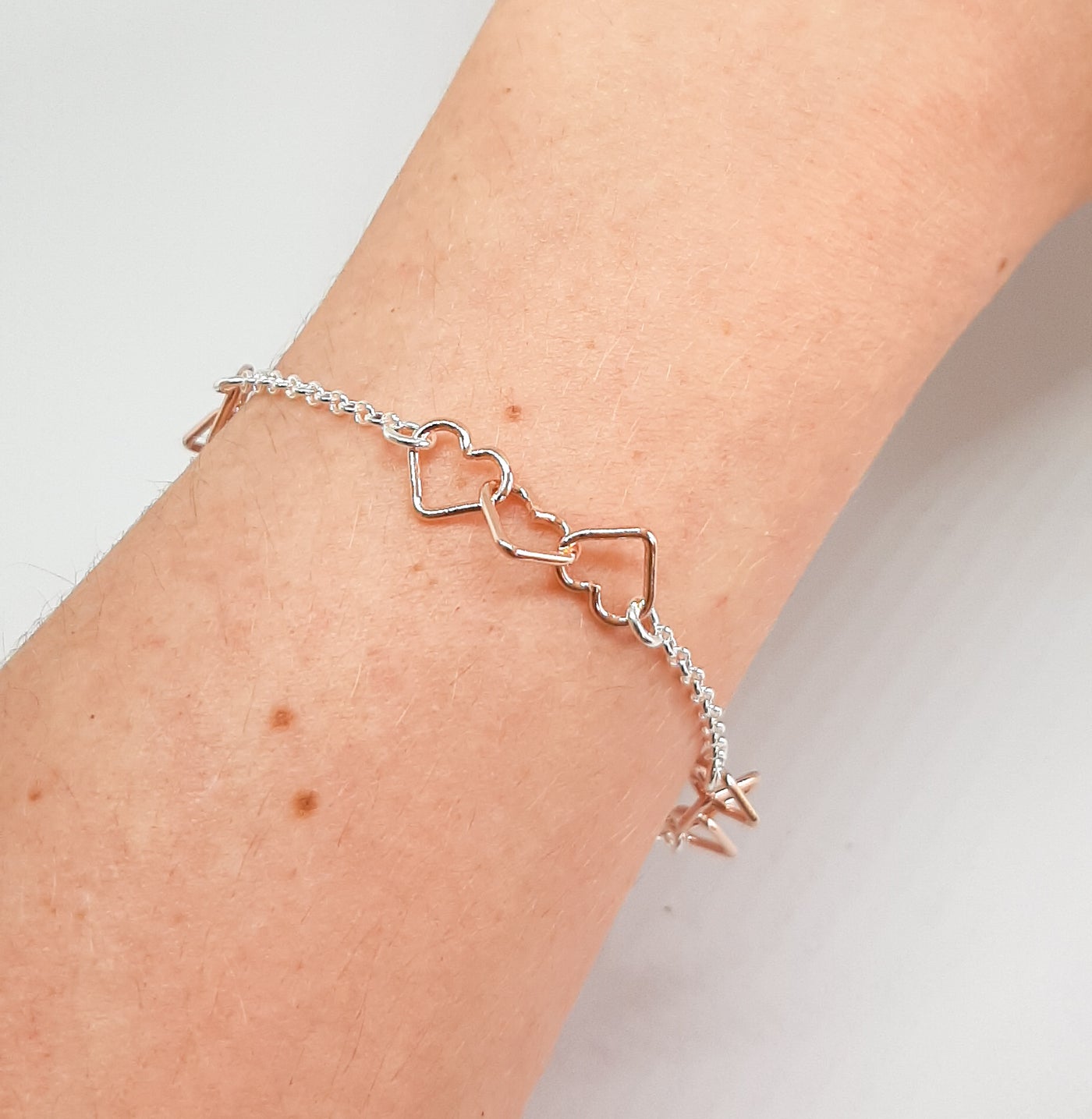 Silver & Rose Gold Linked Hearts Bracelet