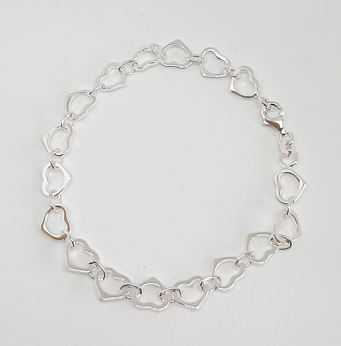 Heavy Silver Linked Hearts Bracelet