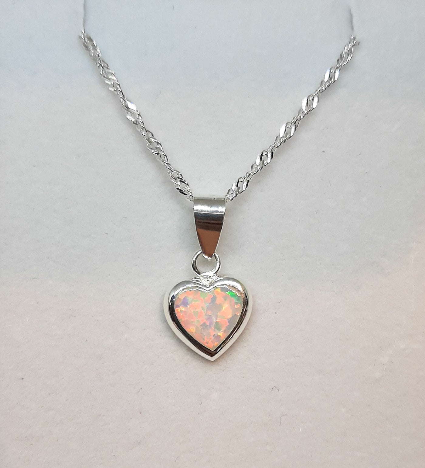 Silver & white opal heart pendant on silver twisted chain
