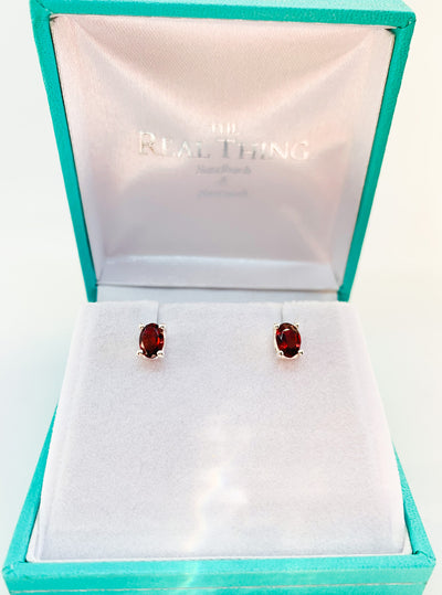 Oval Garnet Claw Set Stud Earrings