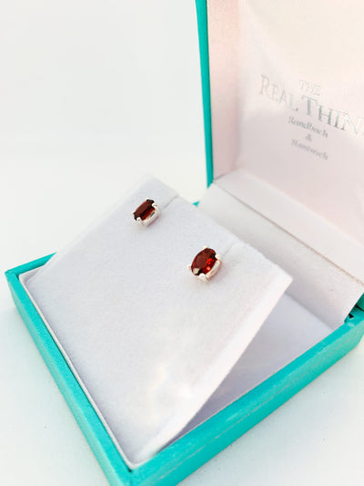 Oval Garnet Claw Set Stud Earrings