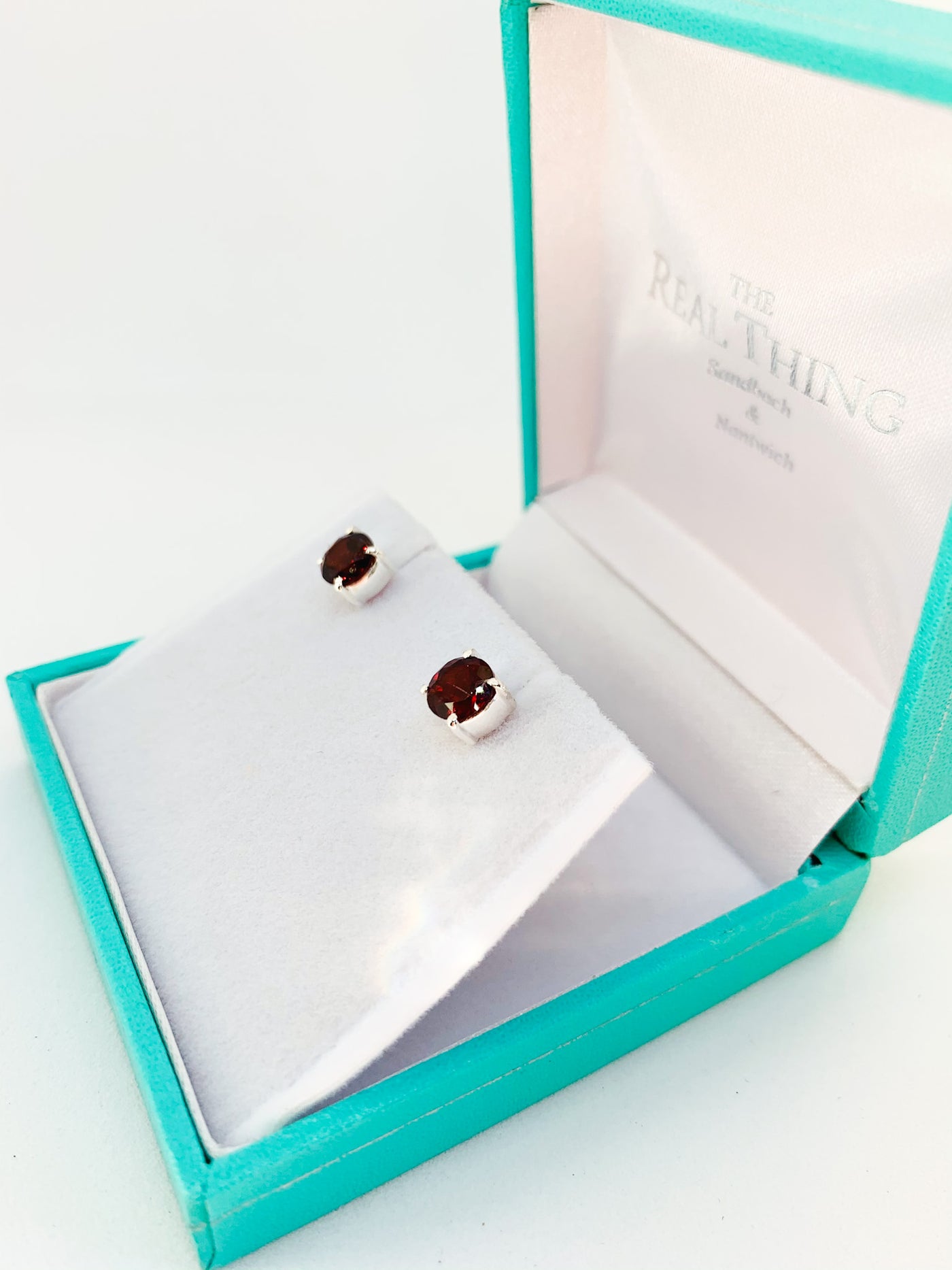 Round Garnet Claw Set Stud Earrings