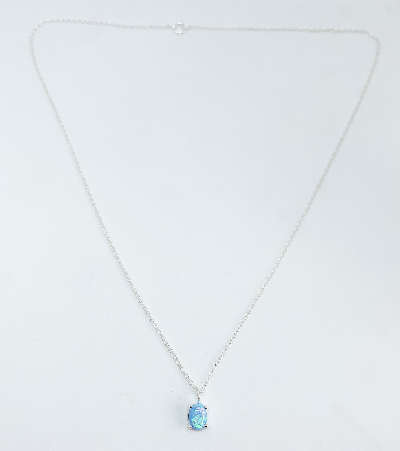 Blue Opal Oval Claw Set Pendant