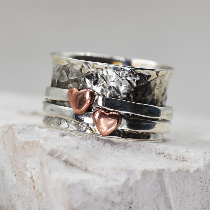 Silver Spinning Ring with 2 copper Hearts.