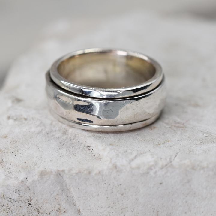 Plain Silver Spinning Ring with hammered finish.